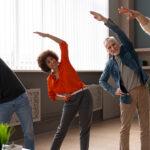 Colleagues at the office-stretching during the work day