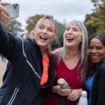 Happy women taking selfie shots during walking club