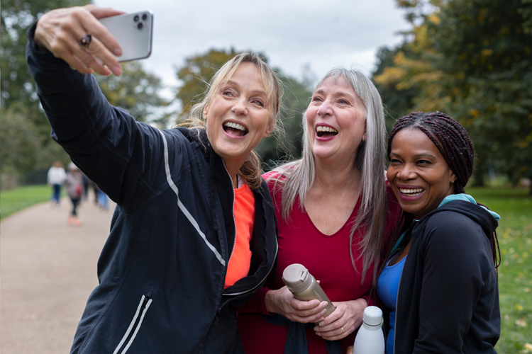 Happy women taking selfie shots during walking club