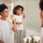 Mother-and-daughter-brushing-their-teeth